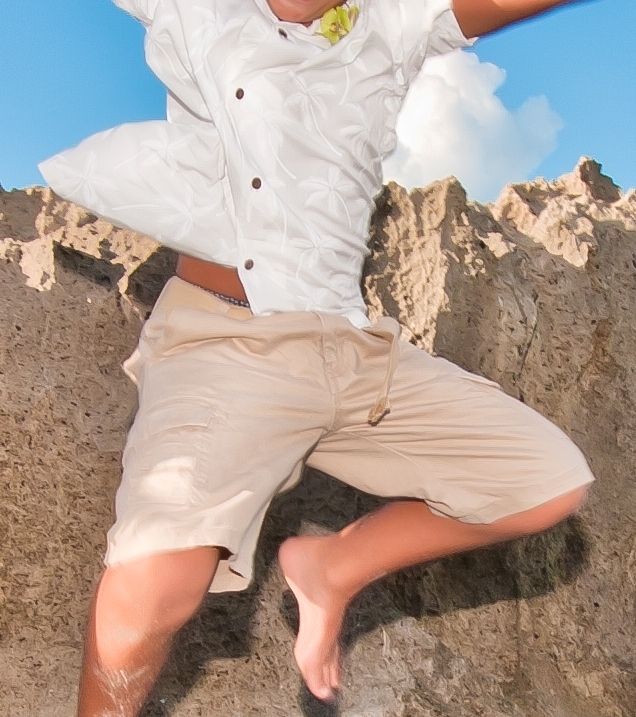 Tropaholic.com-Beach-Wedding-clothes-boy-jumping-off-rocks-into-the-water