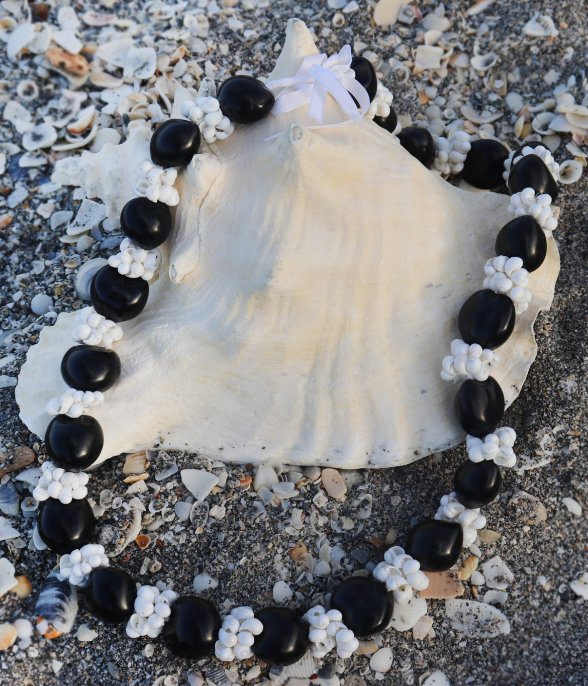 KuKui Nut Necklace with White Shells - lifestyle shot