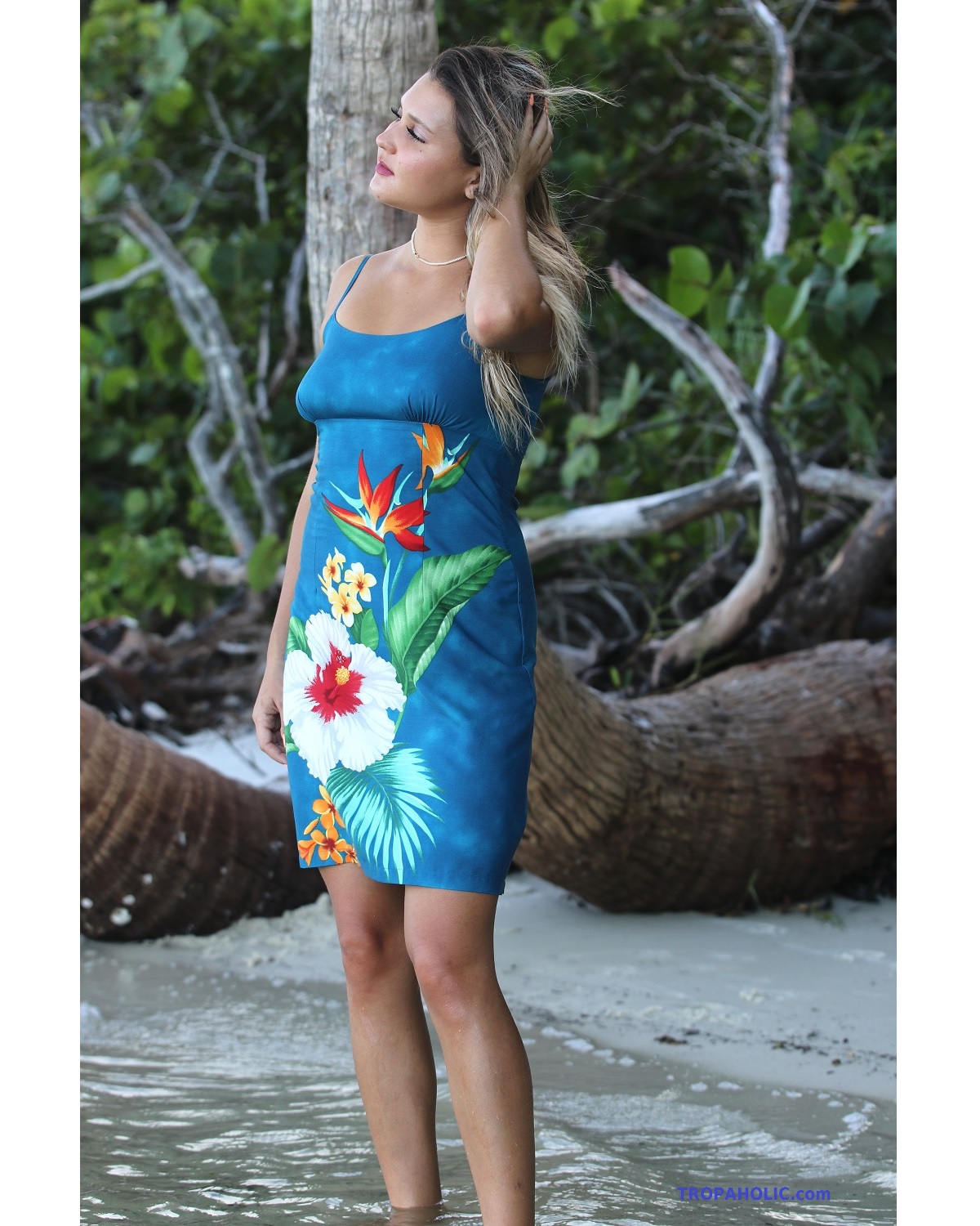 Short Spaghetti Strap Hawaiian Sundress – Tropic Cascade Blue – Model on beach – wind blowing her hair