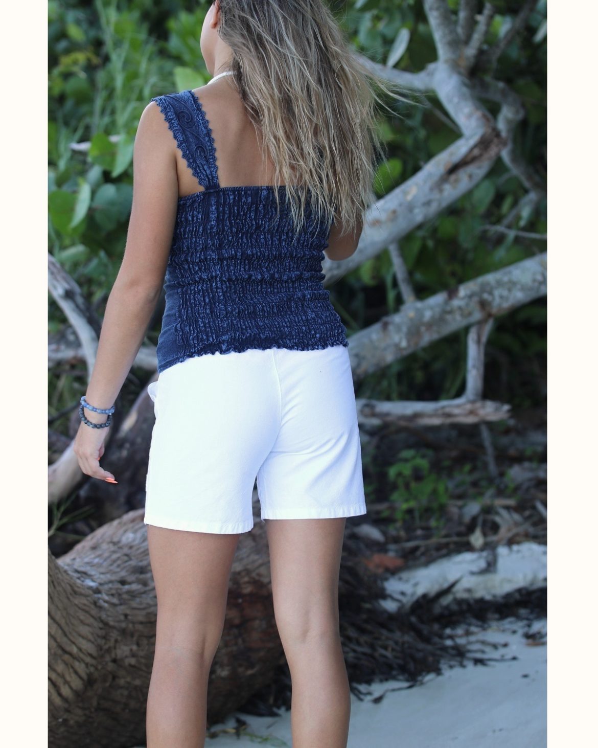 Womens-Shorts-Simple-and-cool-White-Embroidered-Model-on-Tropcial-Beach-Back-view