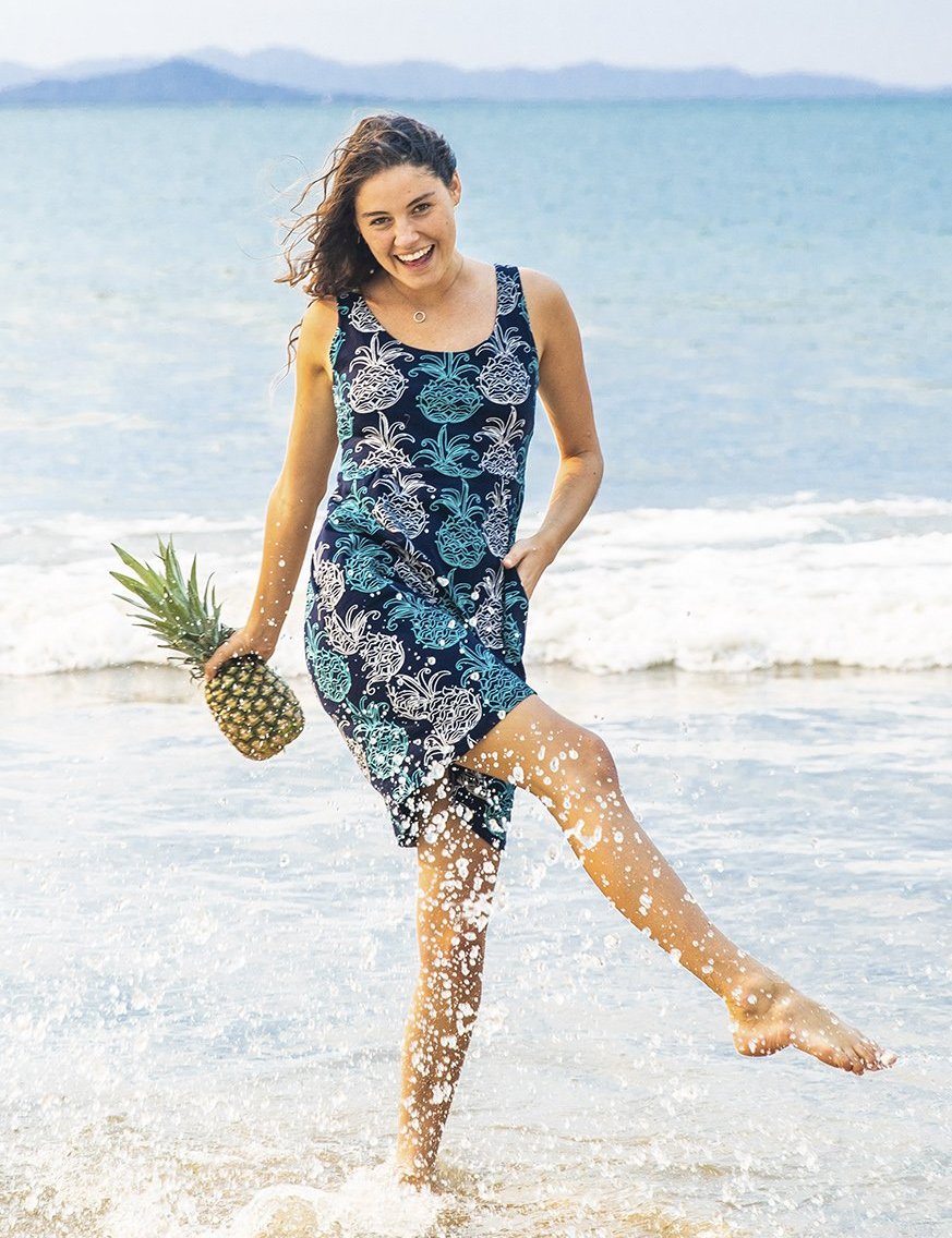 West Indieswear – Tank Dress – Tango – navy – Model on beach splashing in the water